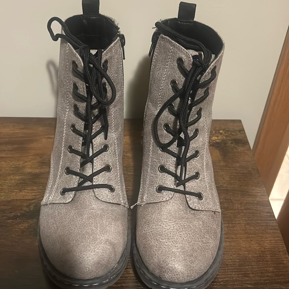 Gray combat boots.